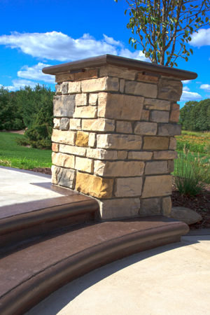 Custom formed concrete steps with cultured stone pillar